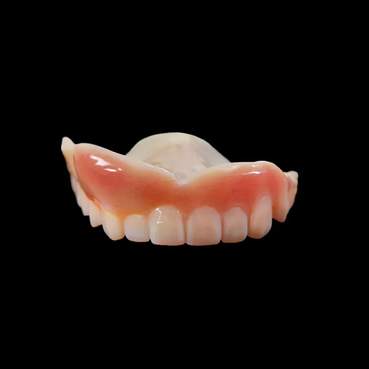 An immediate denture on a black ground