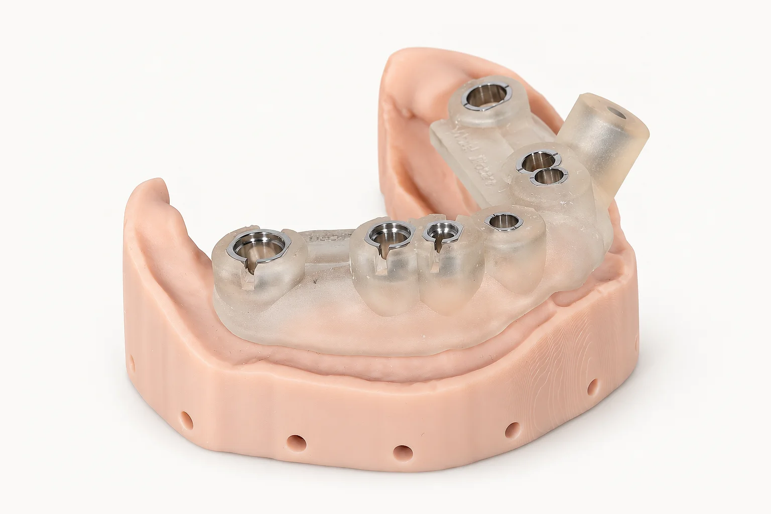A printed linkGuide seated on its model, metal sleeves in place