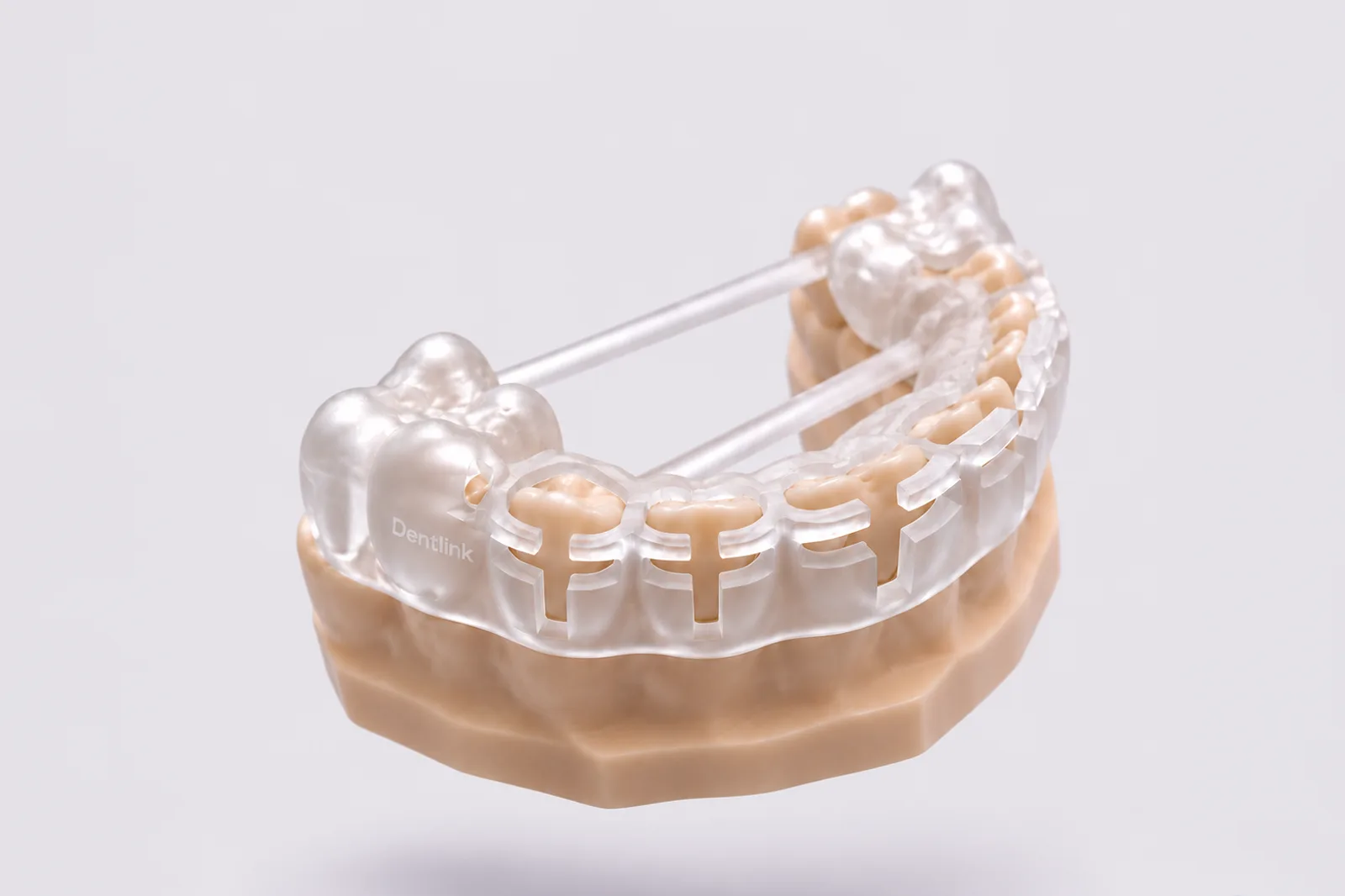 The prep guide on a model under soft light, a periodontal probe beside it