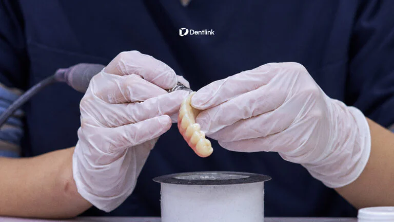 Dedicated dental technician working on a custom restoration at Dentlink dental lab